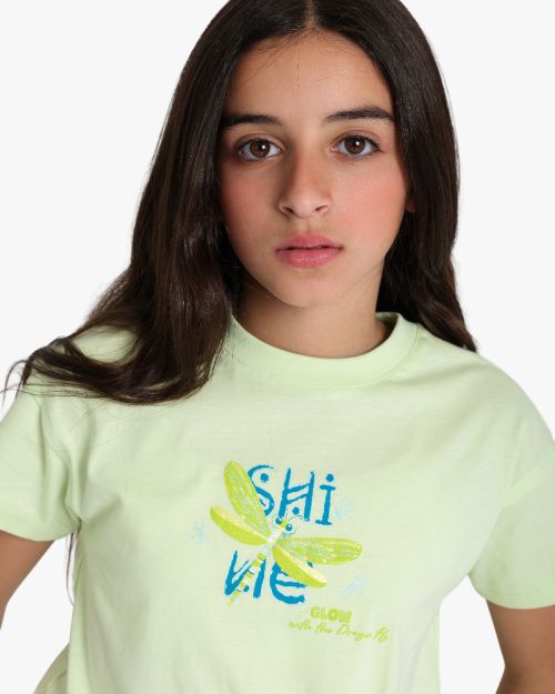 Girls' light green cotton short sleeve t-shirt with dragonfly shine graphic print 4 yrs Front | Locafy