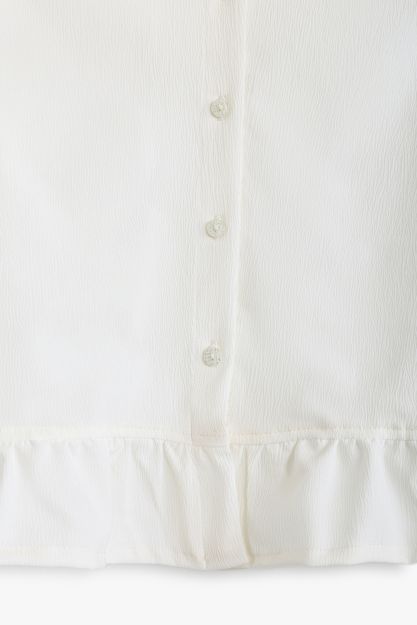 Girls white crinkle-texture button-front shirt with ruffle hem and cuffs 4 yrs Front | Locafy